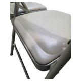 4 Uline H-2522 Padded Folding Chairs - Tan Vinyl Seat and Back