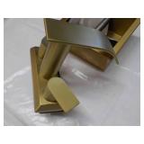 Gold Bathroom Faucet and Toilet Hol...