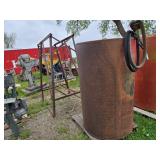Fuel storage tank with pump and metal stand,  The tank measures approximately 39 inches in diameter and 63 inches in height - Approx. 300 gallon
