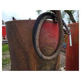 Fuel storage tank with pump and metal stand,  The tank measures approximately 39 inches in diameter and 63 inches in height - Approx. 300 gallon