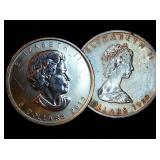 (2) 1 oz Silver Maple Leafs, cull