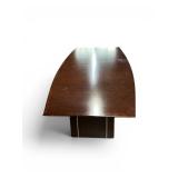 Modern Boat-shaped Conference Table featuring a dark wood finish and a sturdy pedestal base with vertical accents