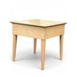 light wood accent table with tapered legs and a minimalist design