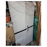 Tall Storage Cabinet With Assorted Garden Supplies