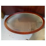 Mahogany Oval Coffee Table 42" X 25 1/4" X 16 with Glass Top and Lower Shelf