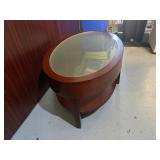 Mahogany Oval Coffee Table 42" X 25 1/4" X 16 with Glass Top and Lower Shelf