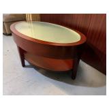 Mahogany Oval Coffee Table 42" X 25 1/4" X 16 with Glass Top and Lower Shelf