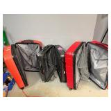 Large Rolling Suitcases: Two Samsonite, One Delsey.  Large Red Samsonite missing front wheel.  30" x 20" x 12", 30" X 20" x 13", 26" x 17" x 11"