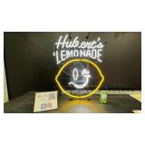Huberts Lemonade neon sign with smiley lemon