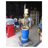 Graco grease pump & 30 gallon tub of grease half full. As shown.