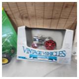 Lot of Die Cast Tractors in Packages as shown