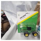 Lot of Die Cast Tractors in Packages as shown