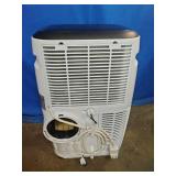 Airo Comfort portable air conditioner featuring a white finish and an included window vent kit