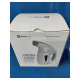 Dritz Jumbo Lint Shaver in blue and white and Brookline Portable Garment Steamer in white.