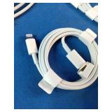 This is a mixed lot of Apple branded white charging cables and power adapters.