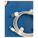 This is a mixed lot of Apple branded white charging cables and power adapters.