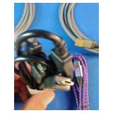 Ten assorted electronic data and charging cables organized against a solid blue background.