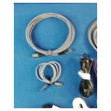 Ten assorted electronic data and charging cables organized against a solid blue background.