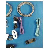 Ten assorted electronic data and charging cables organized against a solid blue background.