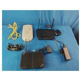 A collection of networking hardware, cables, and power adapters