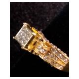 Yellow gold colored multi-row cluster ring featuring a distinctive square or grid-patterned center head. Size 7.25
