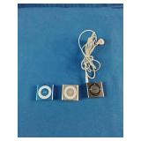 (3) Apple iPod Shuffle 4th Generation devices, known for their ultra-compact design and built-in clip.