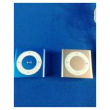 (3) Apple iPod Shuffle 4th Generation devices, known for their ultra-compact design and built-in clip.