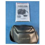 Brand New Vintage 1980's Cortland CX-7 35mm film camera, packaged with its original manual and black carrying case.