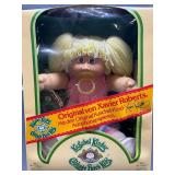 Cabbage Patch Kid - Arxon - German - Pigtail - Lemon Hair - Blue Eyes - Dimples and Pacifier - Girl - MIB