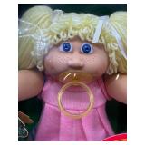 Cabbage Patch Kid - Arxon - German - Pigtail - Lemon Hair - Blue Eyes - Dimples and Pacifier - Girl - MIB