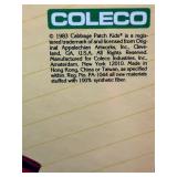 Cabbage Patch Kids - Coleco - 1985 - Ponytail - Lemon Hair - Green Eyes - Girl - Dimple & Glasses (broken) - MIB