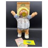 Cabbage Patch Kid - Coleco - Braided Ponytail - Lemon Hair - Green Eyes - Girl - Dimples & Pacifier - with Box