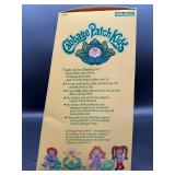 Cabbage Patch Kid - Coleco - 1985 - Double Braided Ponytail - Brown Hair - Violet Eyes - Girl - Dimples & Tooth - MIB
