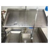 Left side stainless steel drain board; right-side sink