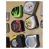 Lot of Tape Measures including Black & Decker AutoTape, Tool Shop 25ft, and Project Pro 25ft
