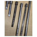 Breaker bar and socket extensions set including various lengths and sizes