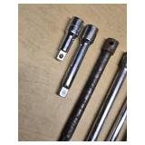 Breaker bar and socket extensions set including various lengths and sizes