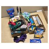 Pet supplies and aquarium items including dog harnesses, aquarium filter, and accessories