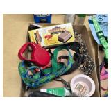 Pet supplies and aquarium items including dog harnesses, aquarium filter, and accessories