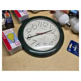 Various Light Bulbs and Wall Clock including Westinghouse Daylight Twist, EverBrite LED, and Sunbeam Anti-Insect Bulbs