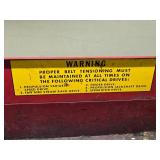 Red Metal Tractor Tool Box with Warning Label