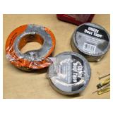 Red Plastic Gas Can, Rolls of Utility Duct Tape, and Small Tools Assortment