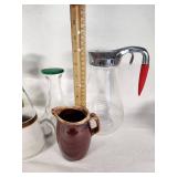 Glass and Ceramic Pitchers including Log Cabin Syrup Pitcher, Hull Pottery Creamer, and Stoneware Japan Creamer