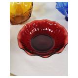 Amber, blue, and red decorative glass bowls