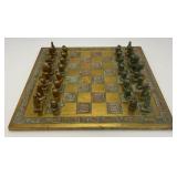 Est. $400.00- $600.00 14' x 14' Vintage Greek Brutalist Bronze Chess Set With Matching Brass Board
