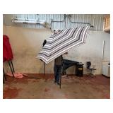Patio umbrella with push button tilt.