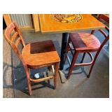 unique high top table with 2 chairs