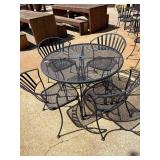 Round black mesh metal table and chairs