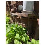 Contents of Fence - Antique Primitive items, Cast iron, Antique Hay Loaders etc