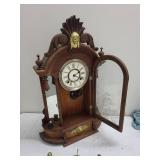 Ornate Wood Mantel Clock With Pendulum & Figural Accents